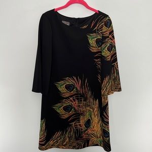 Make a statement with this gorgeous peacock dress. Size 8.